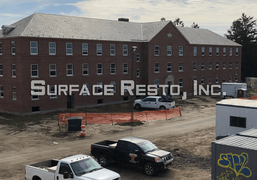 Three-story brick building before sandblasting