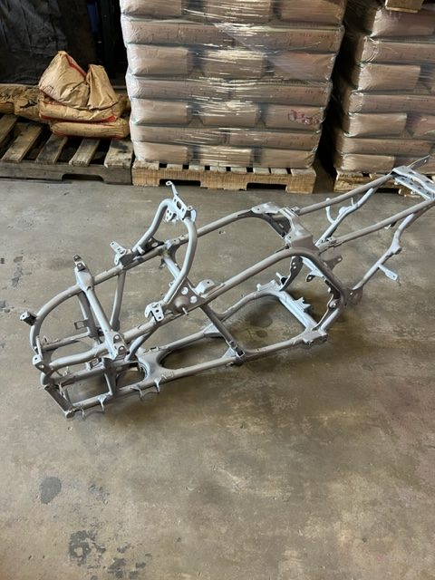 Motorcycle frame sandblasted to bare metal for powder coating