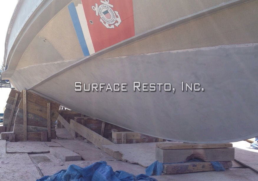 Coast Guard boat hull in Massachusetts after bottom paint removal