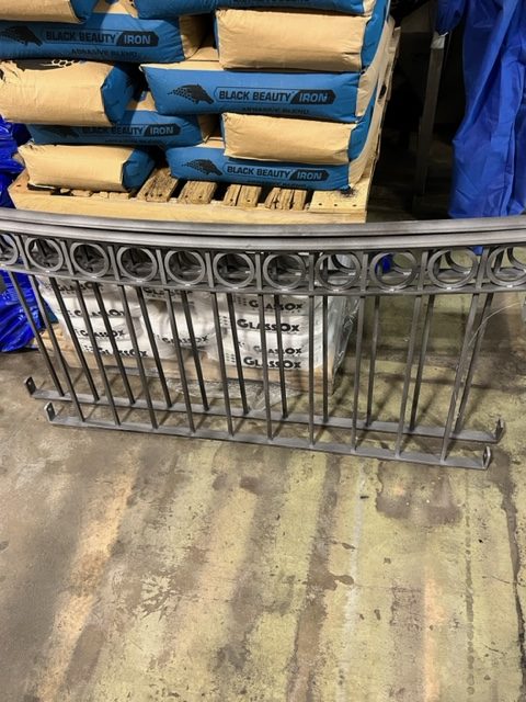 Wrought-iron railing section after bronze powder coating