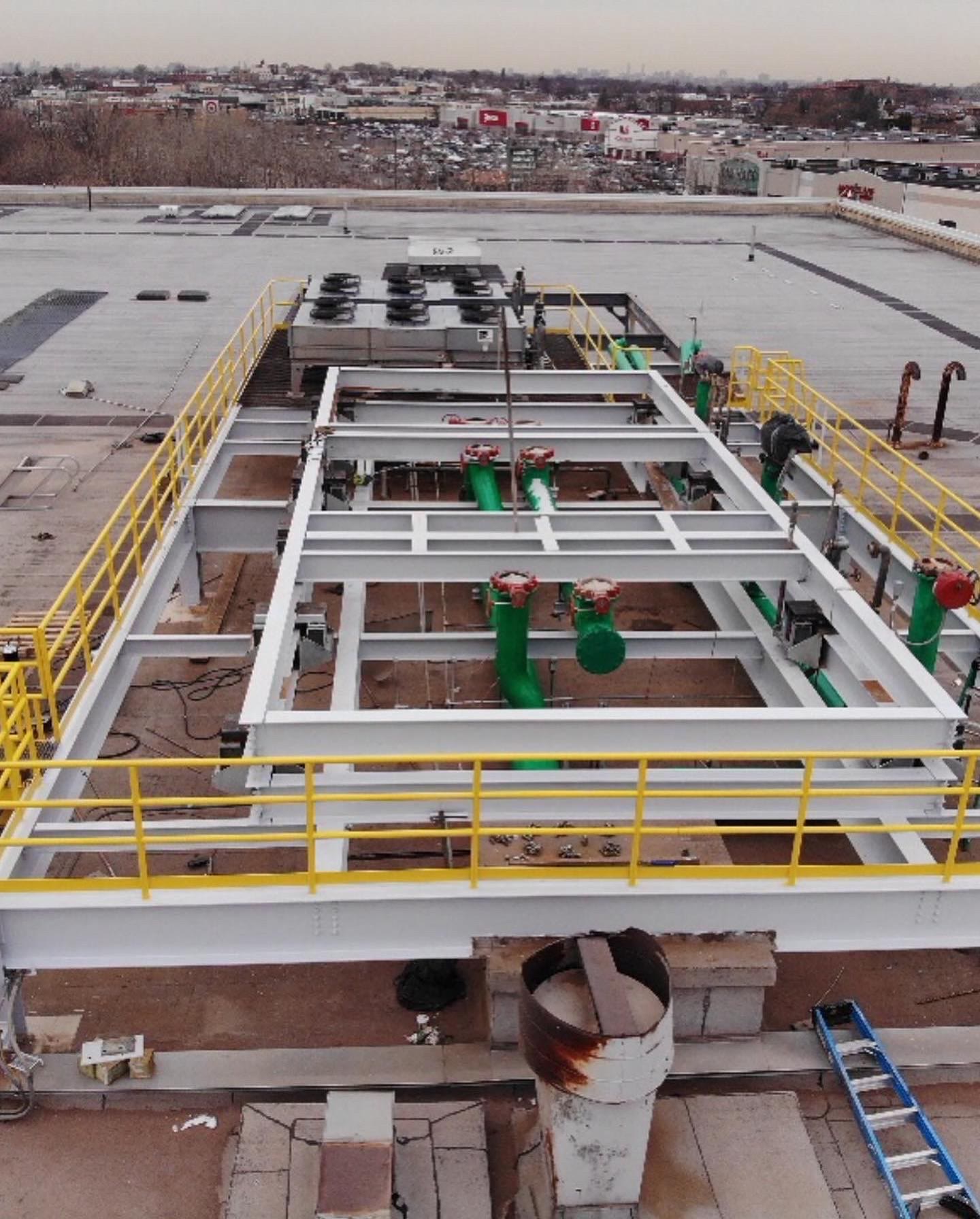 Coated rooftop steel platform seen from above after sandblasting and painting